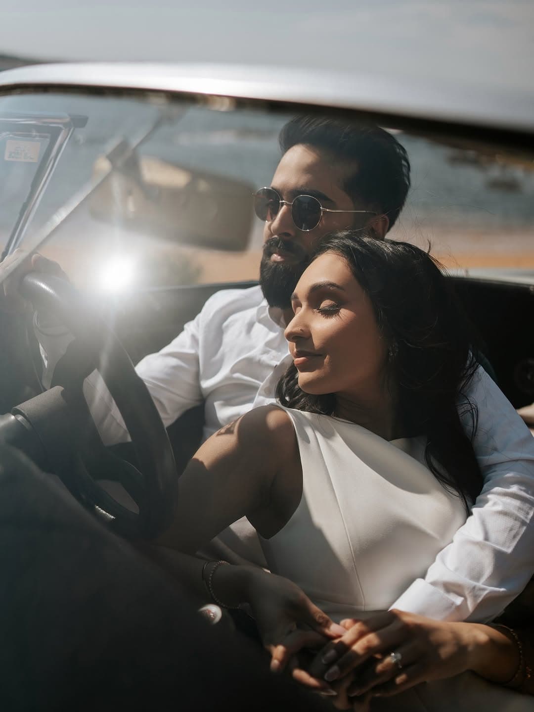 Bridal portrait — intimate moment inside vintage convertible